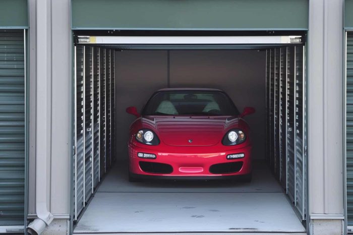 car storage Rochester - a red car inside a storage unit